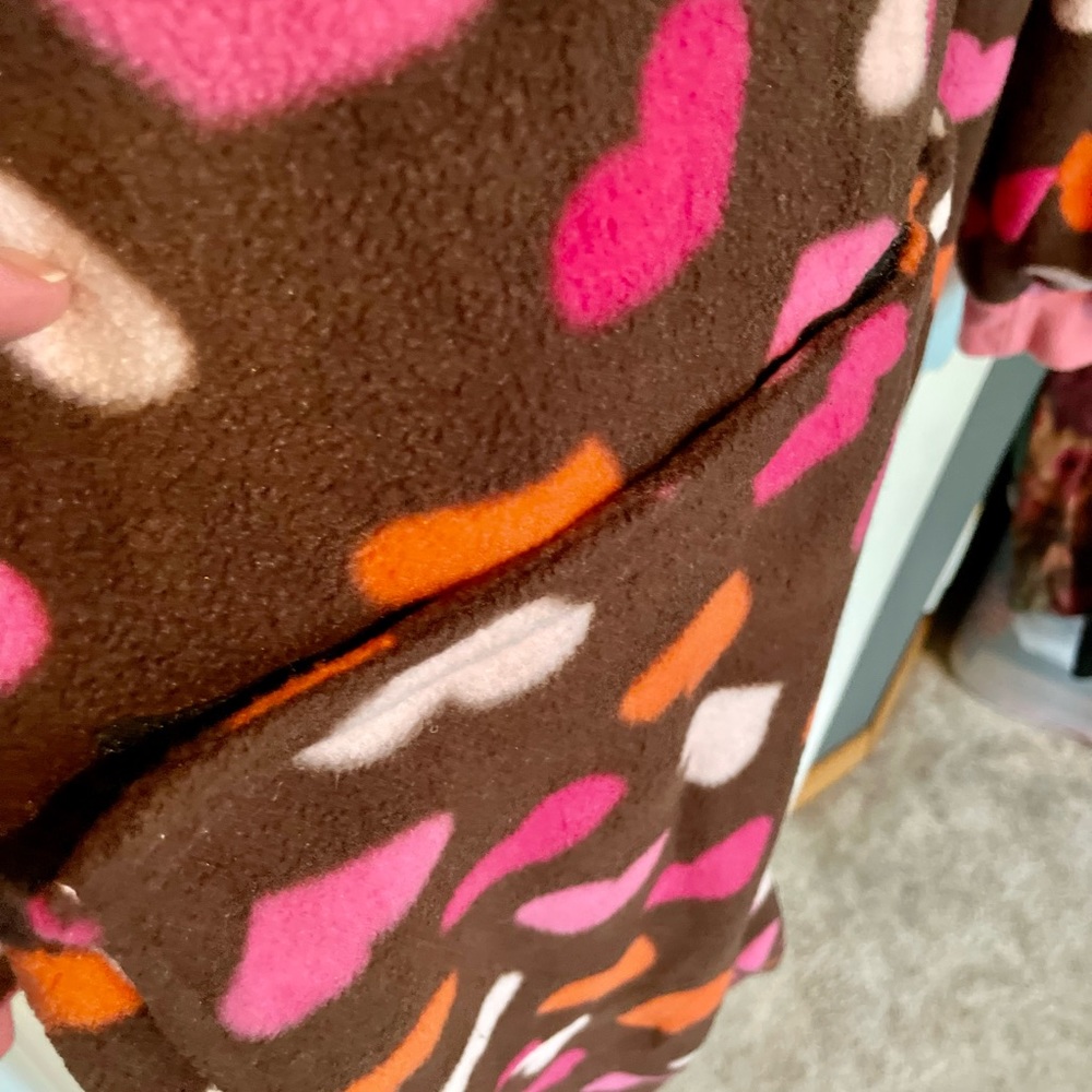 Fun onsie, footie jammies with a Velcro trap door in the back side!